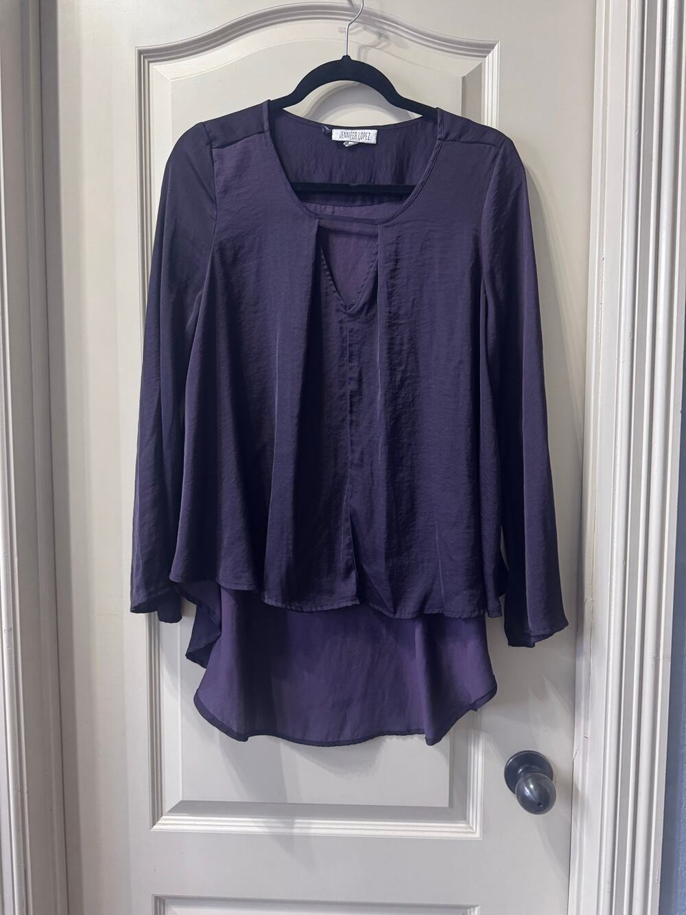 Deep purple high low peekaboo Jennifer Lopez silky top